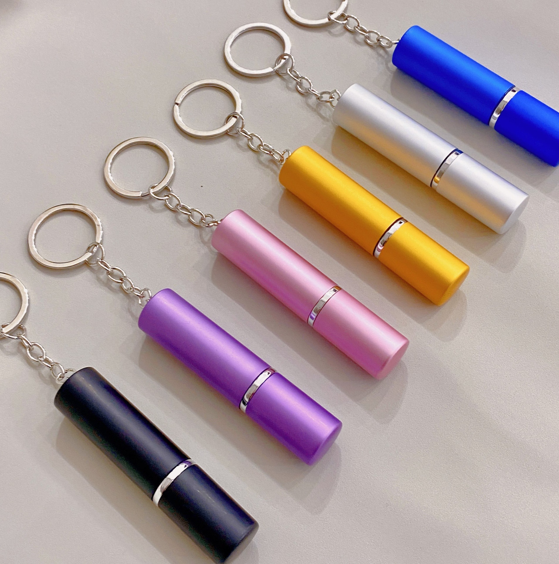 Multifunksionele draagbare mini 5ml parfuum of peper spaarbottel sleutelhanger